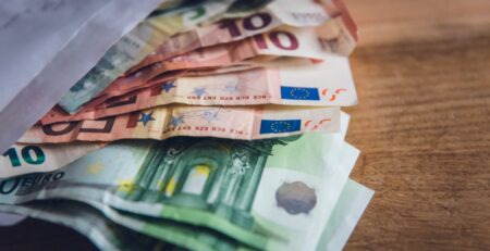 euro banknote collection on wooden surface
